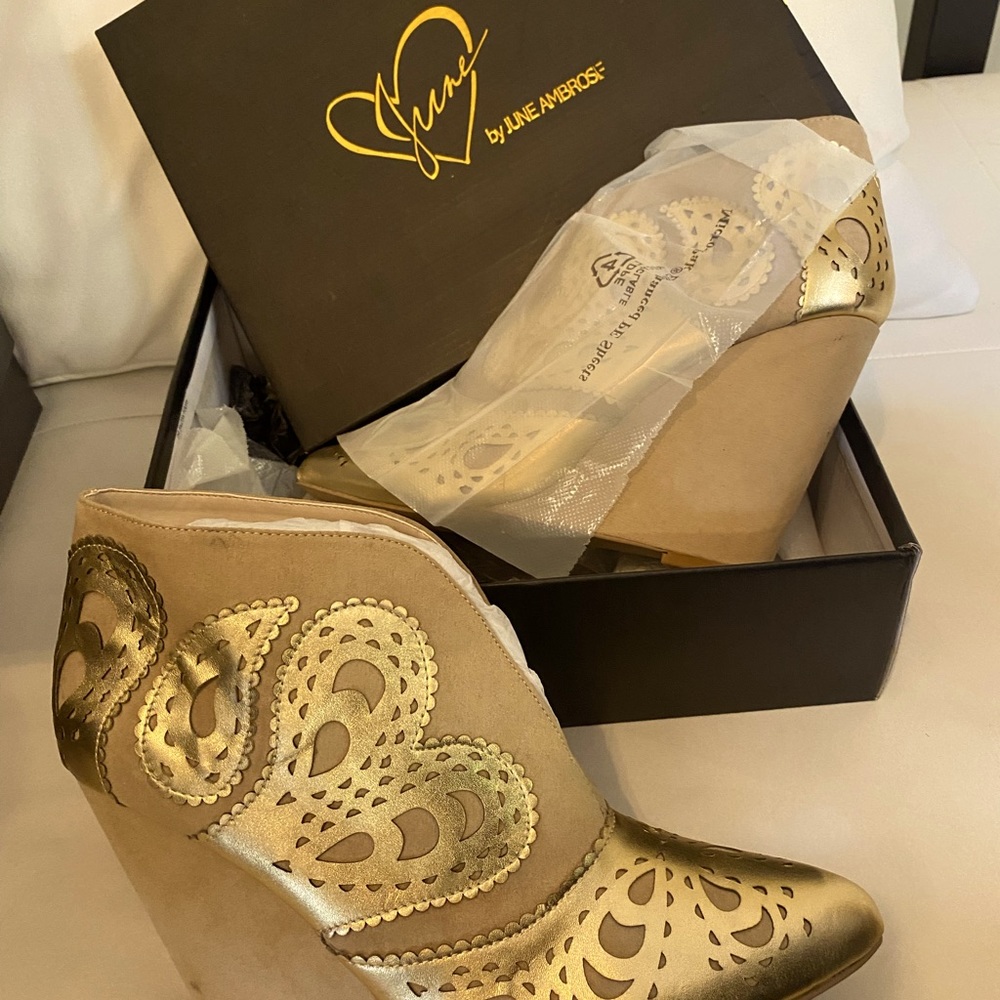 Nude and gold platform booties.